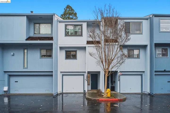 View of front of property with an attached garage and driveway
