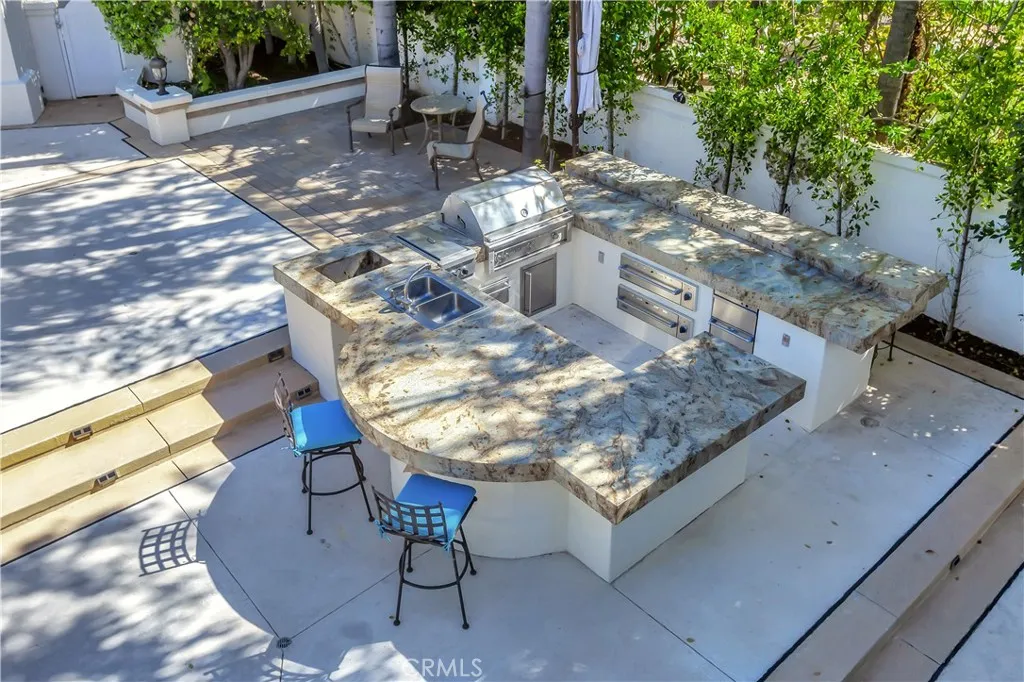 Outdoor Kitchen with plenty of seating