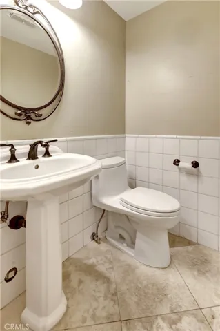 Powder room off the main entry hall downstairs