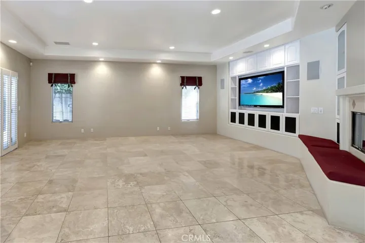 Family Room off the kitchen - with AI image on TV