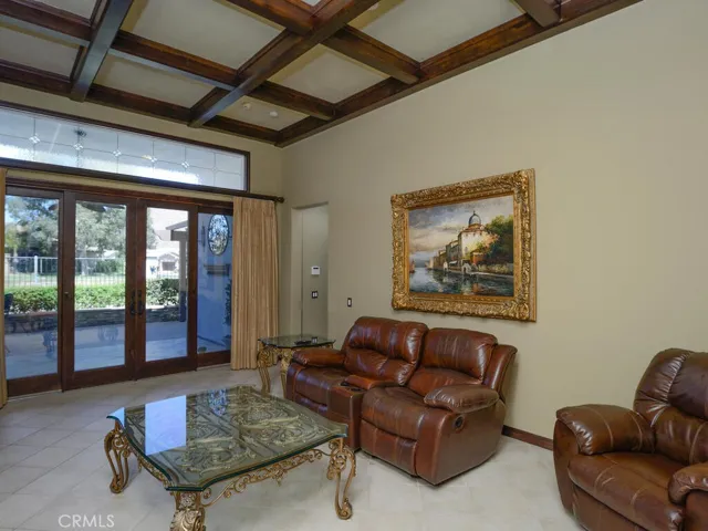 Living room showing part of coffered ceiling