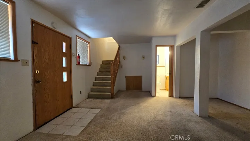Lower level with separate door, stairs to mid level