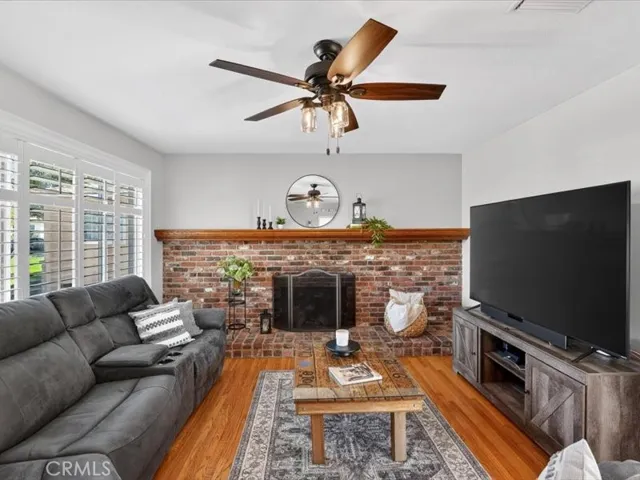 No Popcorn ceilings, hardwood flooring. Expansive brick fireplace is the heart of the home. Plantation Shutters open on top and bottom