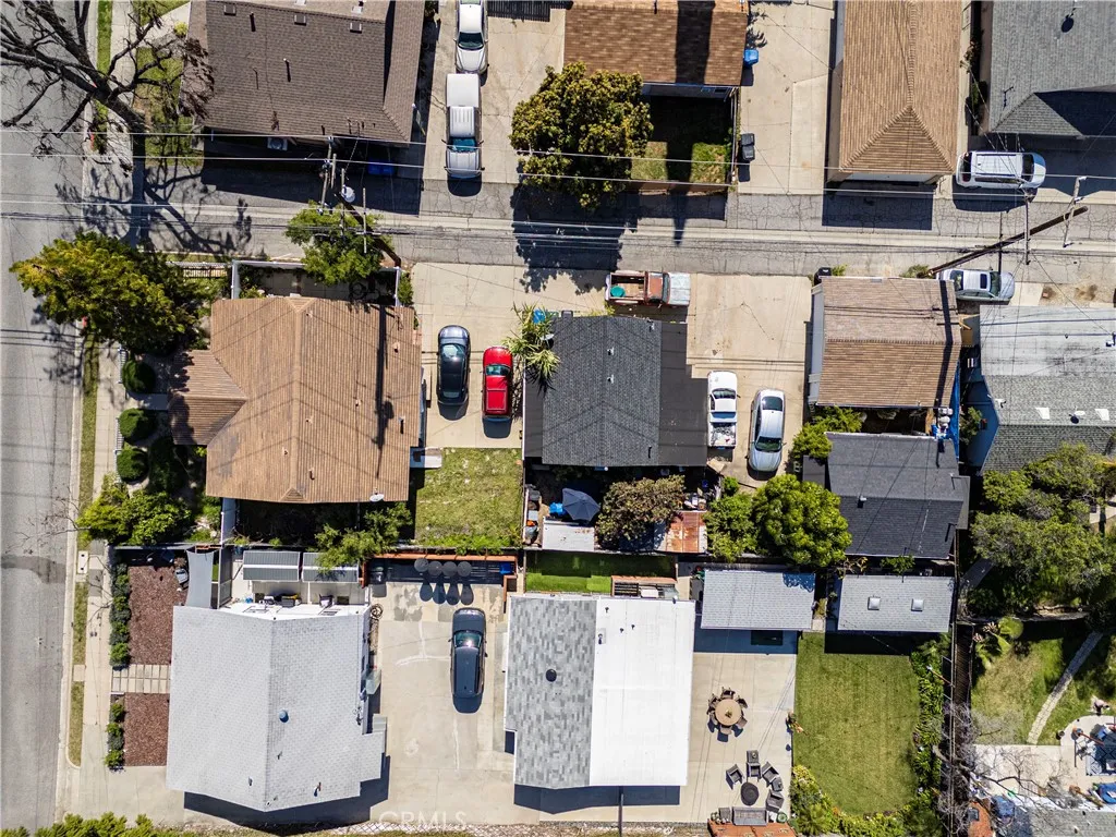 Direct overview drone view of all 3 units,showing parking & alley