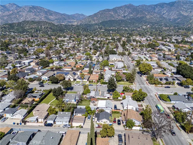 Drone view of the triplex, showing the alley, Magnolia Ave running North/South & beautiful foothills
