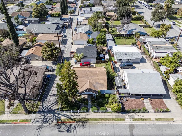 Drone view of three units from Magnolia Ave, showing the alley running East/West