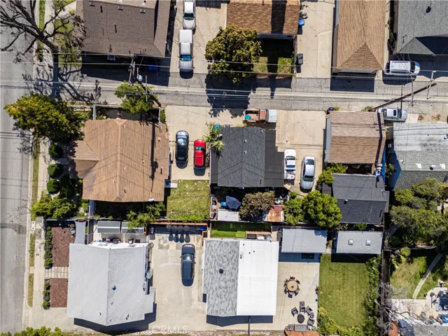 Direct overview drone view of all 3 units,showing parking & alley