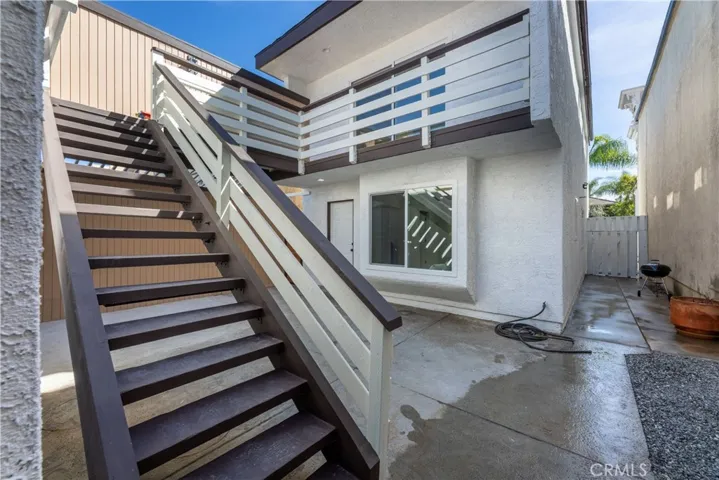 Stairs to upper deck from rear patio