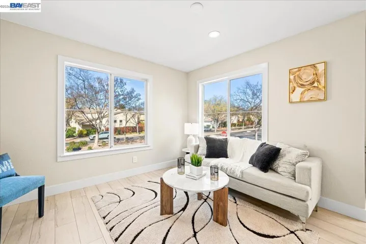 COZY AND OPEN TO NOOK AND KITCHEN STYLE.  PLENTY OF NATURAL LIGHT.