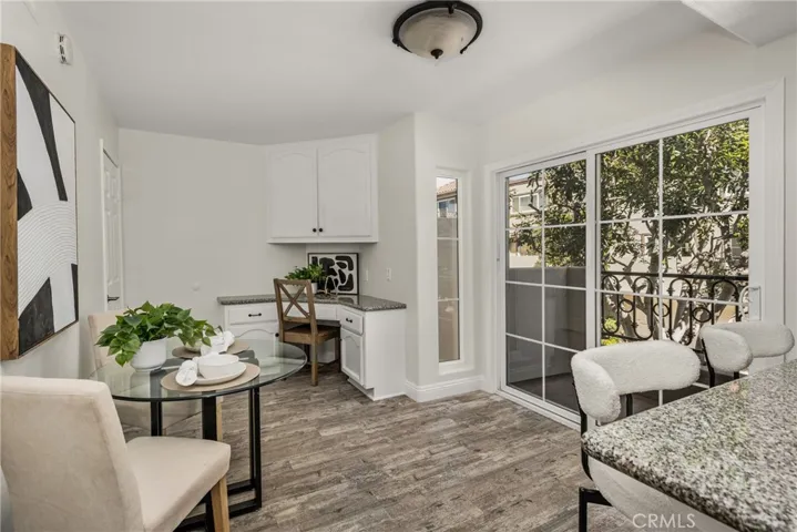 The kitchen with room for a casual dining table, and a convenient built in desk