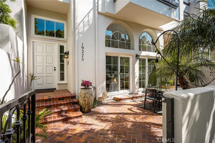A closer view of the inviting entrance and courtyard patio