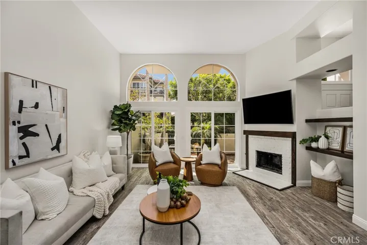 Sunlit living with a cozy fireplace