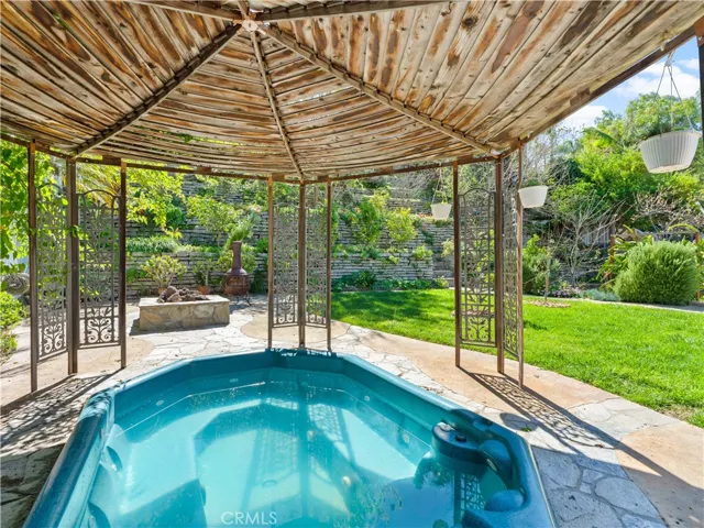 In Ground Spa under Petered Brass and Distressed Teak Wood Gazebo