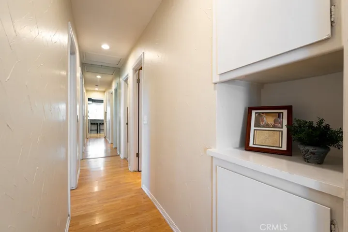 Hallway to the 3 bedrooms and 2 full bathrooms