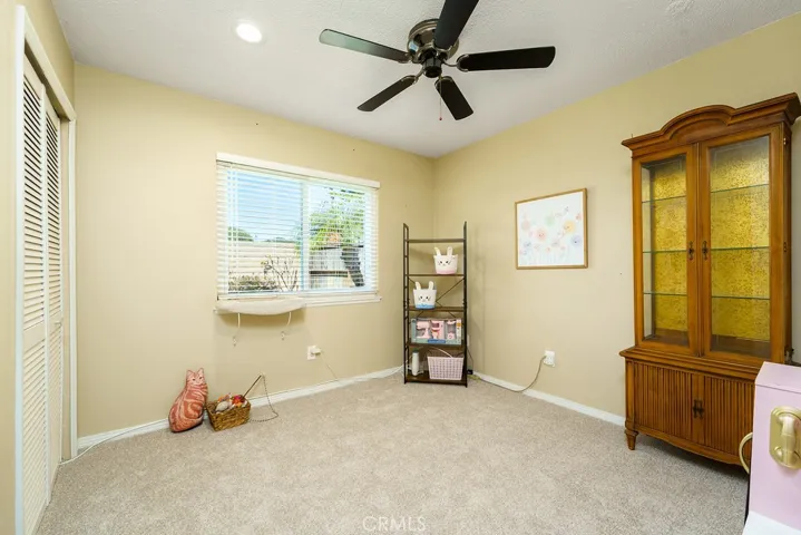 Bedroom number 2 with recessed lighting and ceiling fan.