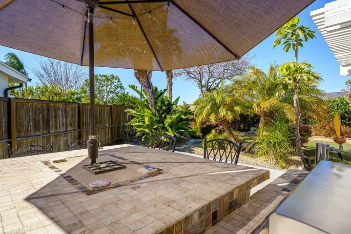 Travertine tile counter at the bar and Built in BBQ