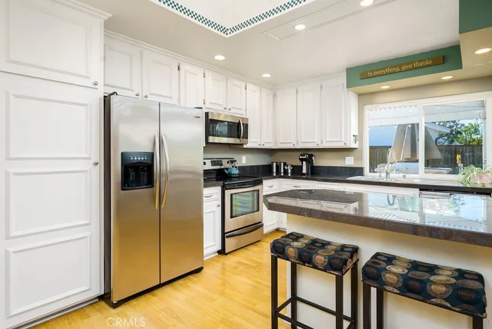 Gigantic sky light and recessed lighting in the bright and sunny kitchen!