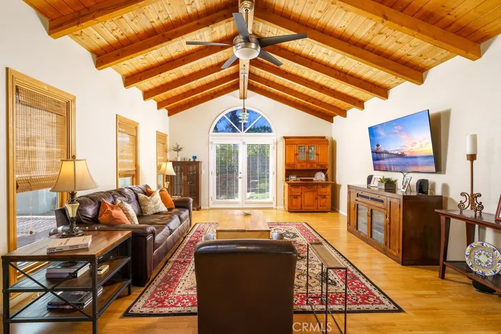 Here is the Greatroom! WOW! Tall triple windows behind the sofa.