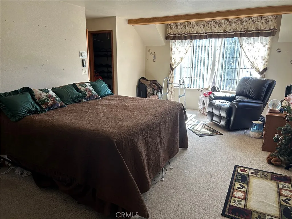 Huge master suite is bright and cheery   At buyer's request, most of the furniture will stay