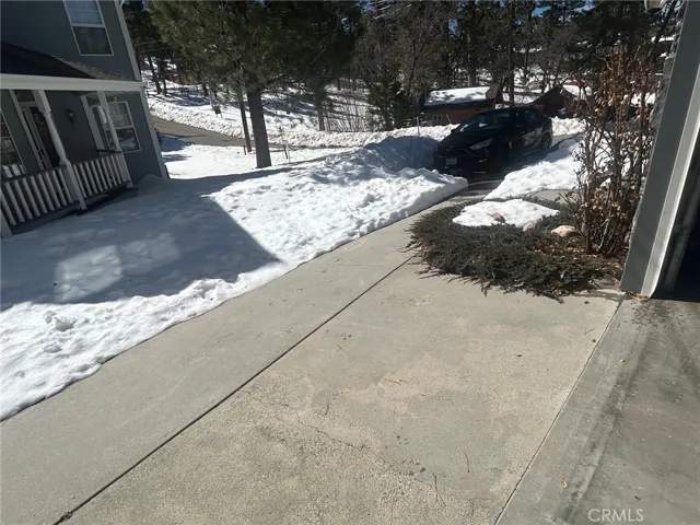 See the car.  That is your driveway as well as the slab as you enter the garage. Gentleman easement access for two neighbors.  Easy explanation.   The white stuff is certified freezing dihydrogen monoxide. OK SNOW!