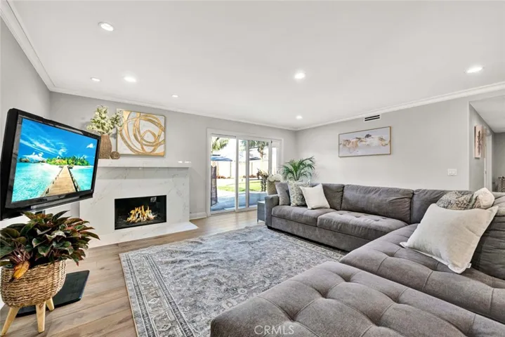Inviting living room with custom fireplace and sliding doors leading to the backyard.