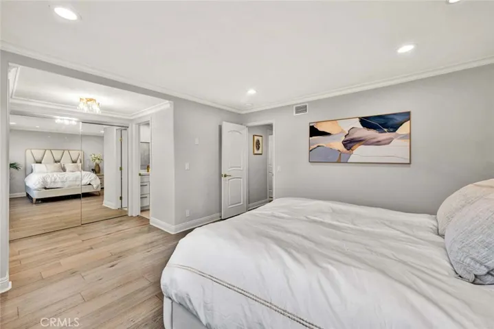 Generously sized bedroom with clean modern finishes and neutral tones.