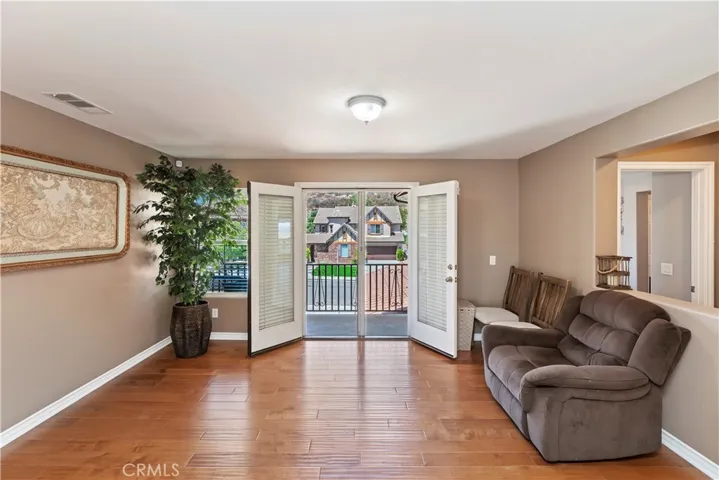 Loft or Game Room w/ doors out to Front Balcony