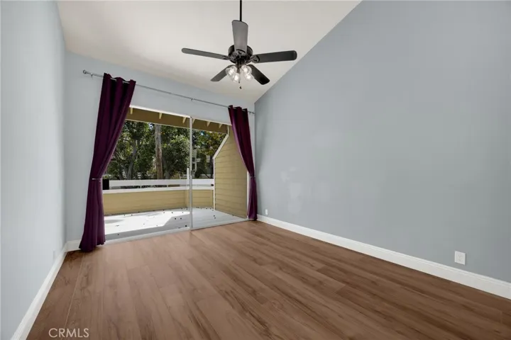 Main master bedroom overlooks patio with babbling creek below