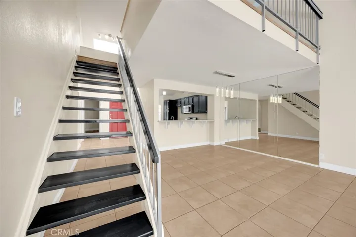 Stairs lead to loft which offers flexible use space.