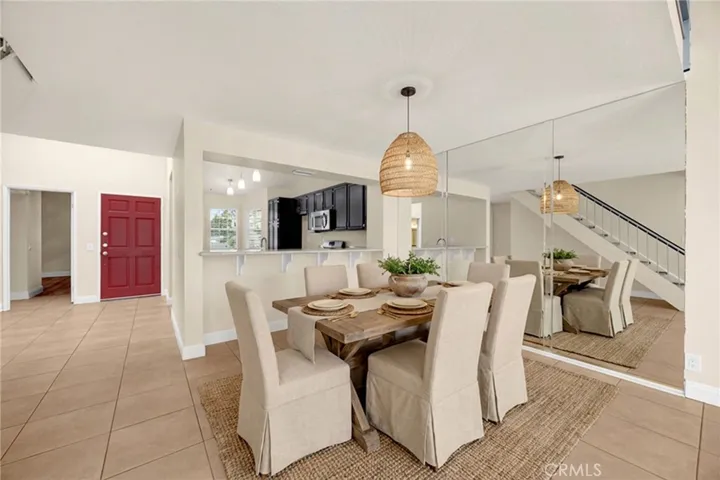 VIRTUALLY STAGED Dining table area between kitchen & living room