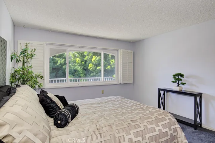 Large Primary Bedroom - Property is unfurnished - staging furniture in photo.