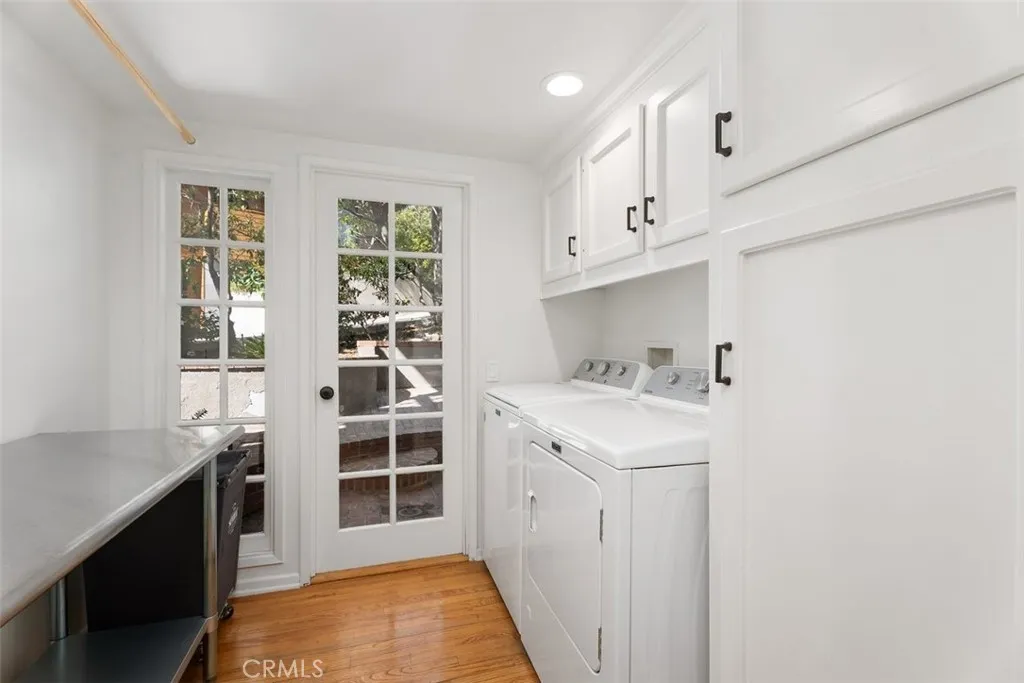 The laundry room is conveniently located on the first floor and opens to the side of the house and also has plenty of natural light.  The washer and dryer are being sold with the home.
