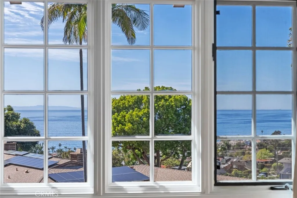 Views of Catalina Island can be seen from the primary bedroom suite.  Do you see any whales?