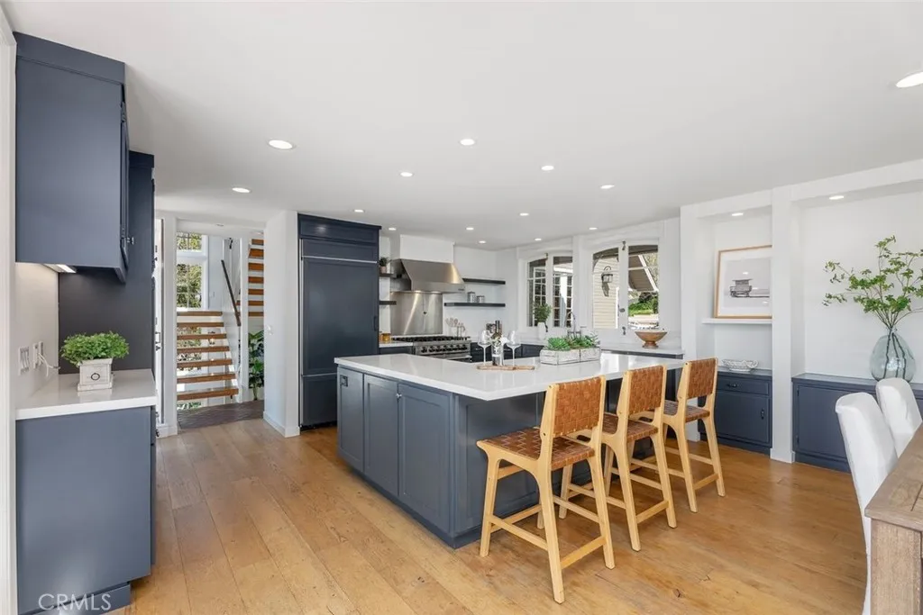 Open concept kitchen where everyone gathers before heading outside on the deck!