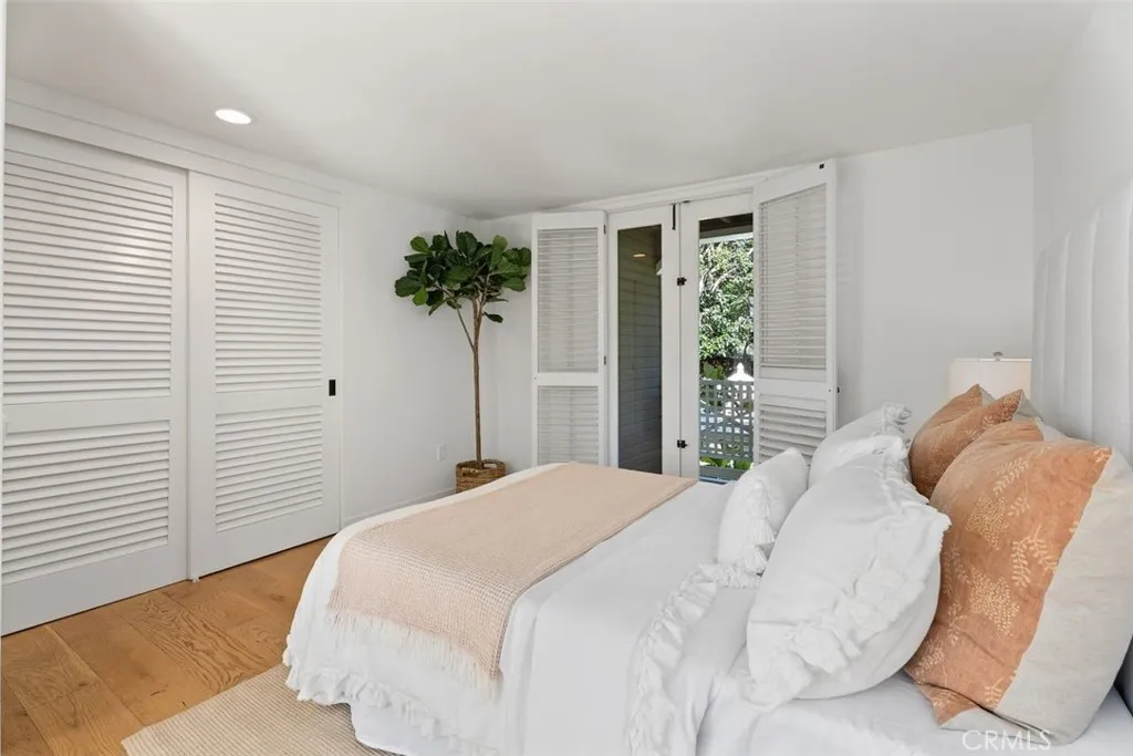 Guest Bedroom #3 sits on the first floor on the corner of the home.  It also has a small balcony with a door leading outside.