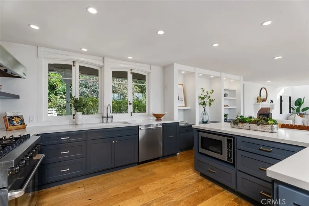 This kitchen has a wonderful flow as you create gourmet meals while enjoying the natural light and gardens.