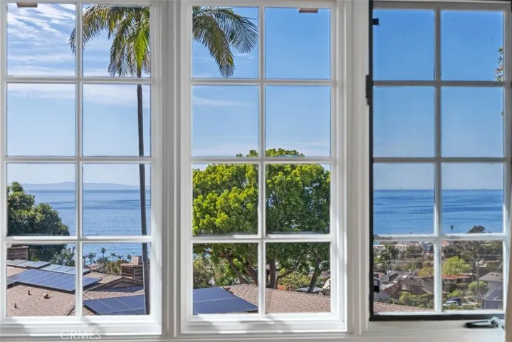 Views of Catalina Island can be seen from the primary bedroom suite.  Do you see any whales?
