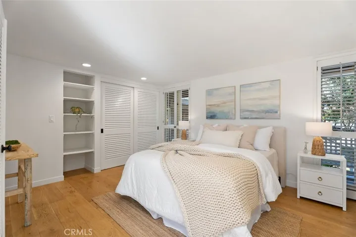 Guest bedroom #2 is located on the first floor and enjoys 2 small balconies with french doors leading outside to the garden.