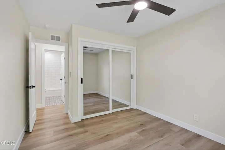 edroom with Mirrored Closet Doors