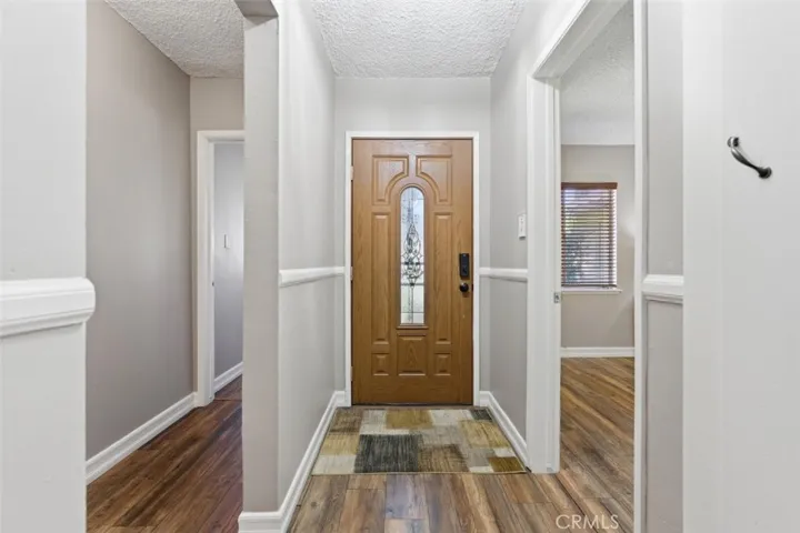Front Entry. Bedroom 4 (Guest) to the Right. Hallway to Primary Bedroom to the Left.