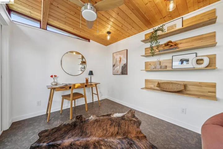 Office area with wooden ceiling and ceiling fan