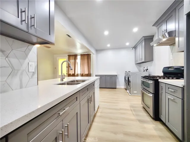 ABUNDANCE of cabinets and counter space perfect for entertaining