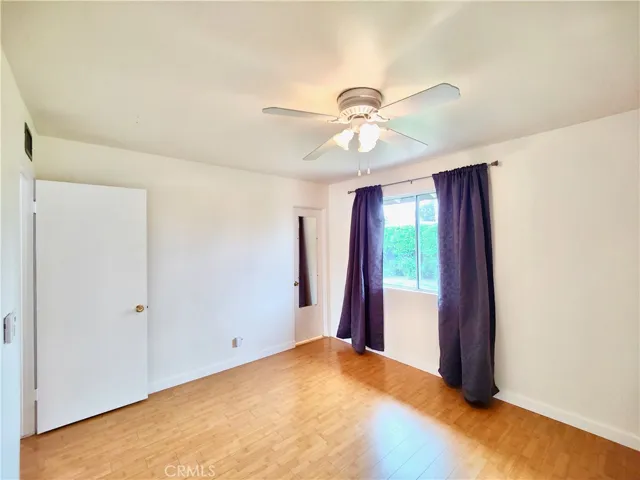 Primary Bedroom with views of backyard