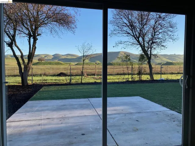 View of patio / terrace featuring a view of countryside and a mountain view