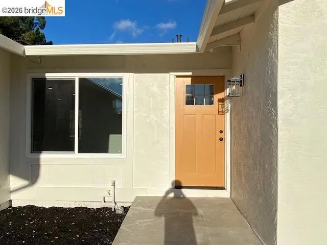 Property entrance with stucco siding