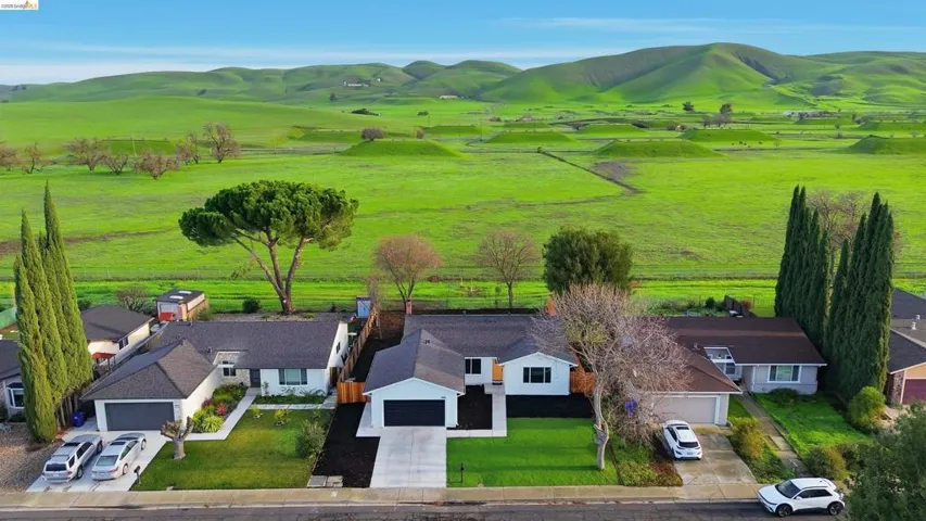 Overview of rural landscape with a pastoral area and mountains