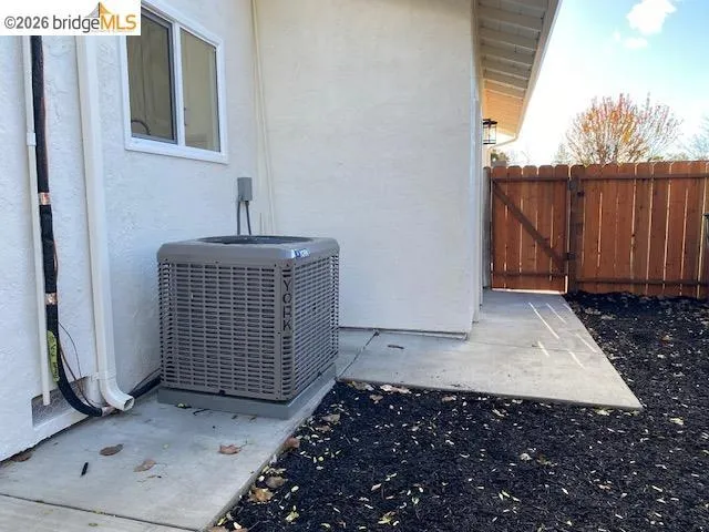 Exterior view of a gate and stucco siding