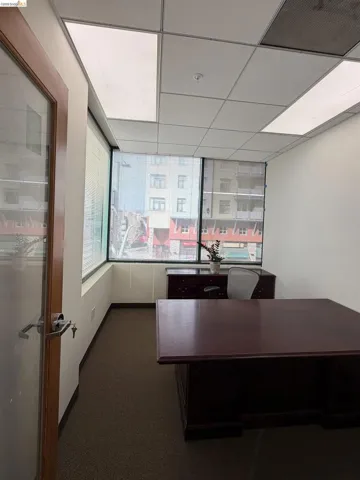 Office area featuring a paneled ceiling