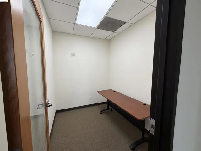 Unfurnished office with a drop ceiling