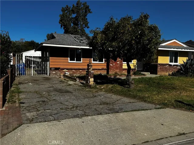 View down driveway toward two-car garage